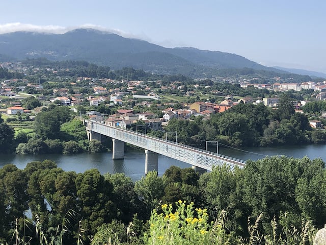 view looking down to bridge over minho river border between portgual and spain