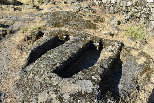 coffins carved into granite rock