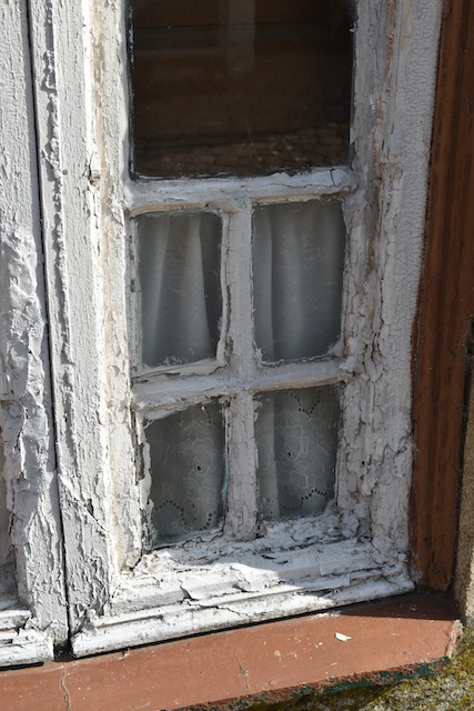 window frame with lots of putty repairs