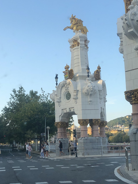 tall ornate statue on bridge